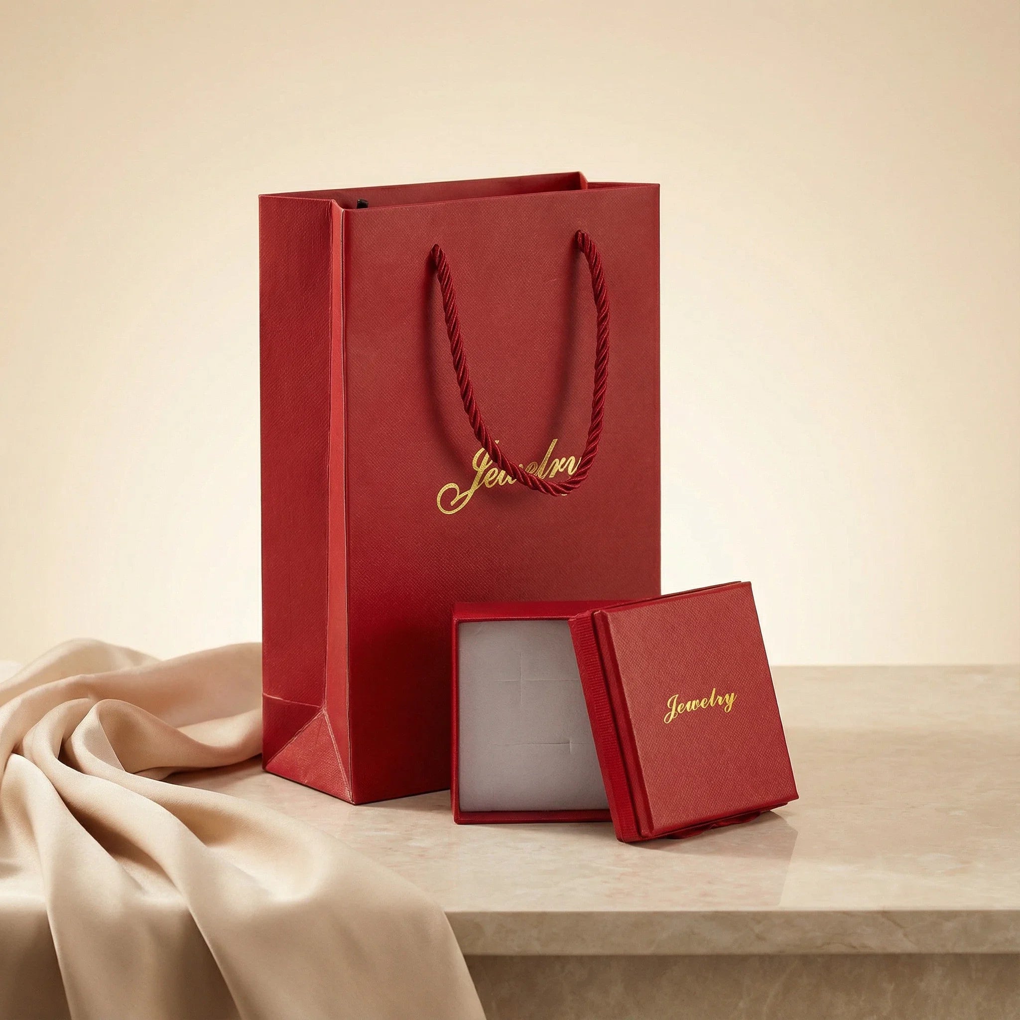 Small red jewelry box shown open with white insert for rings, earrings, brooches, or chainless pendants