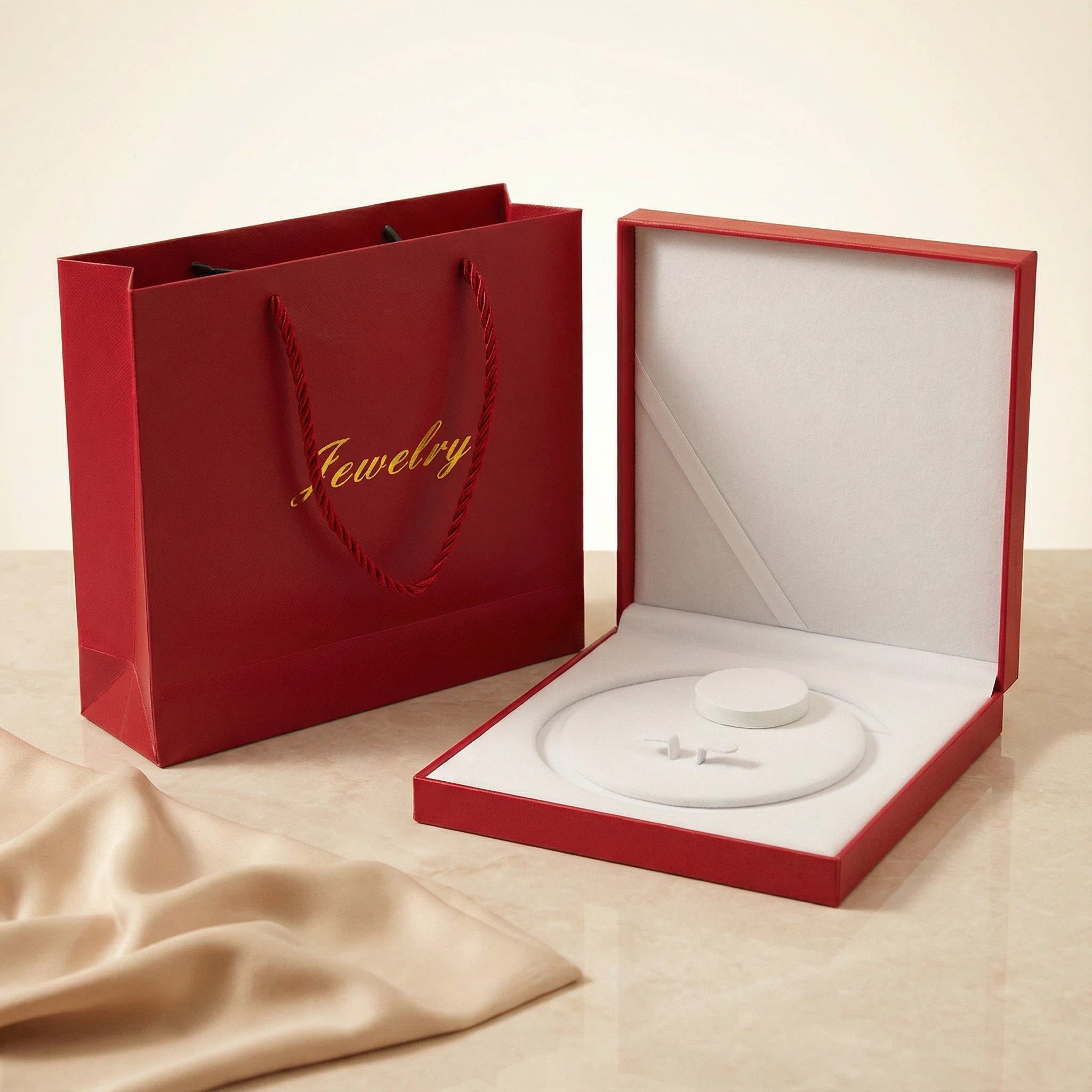 Large red jewelry box shown open with white insert designed for necklace packaging